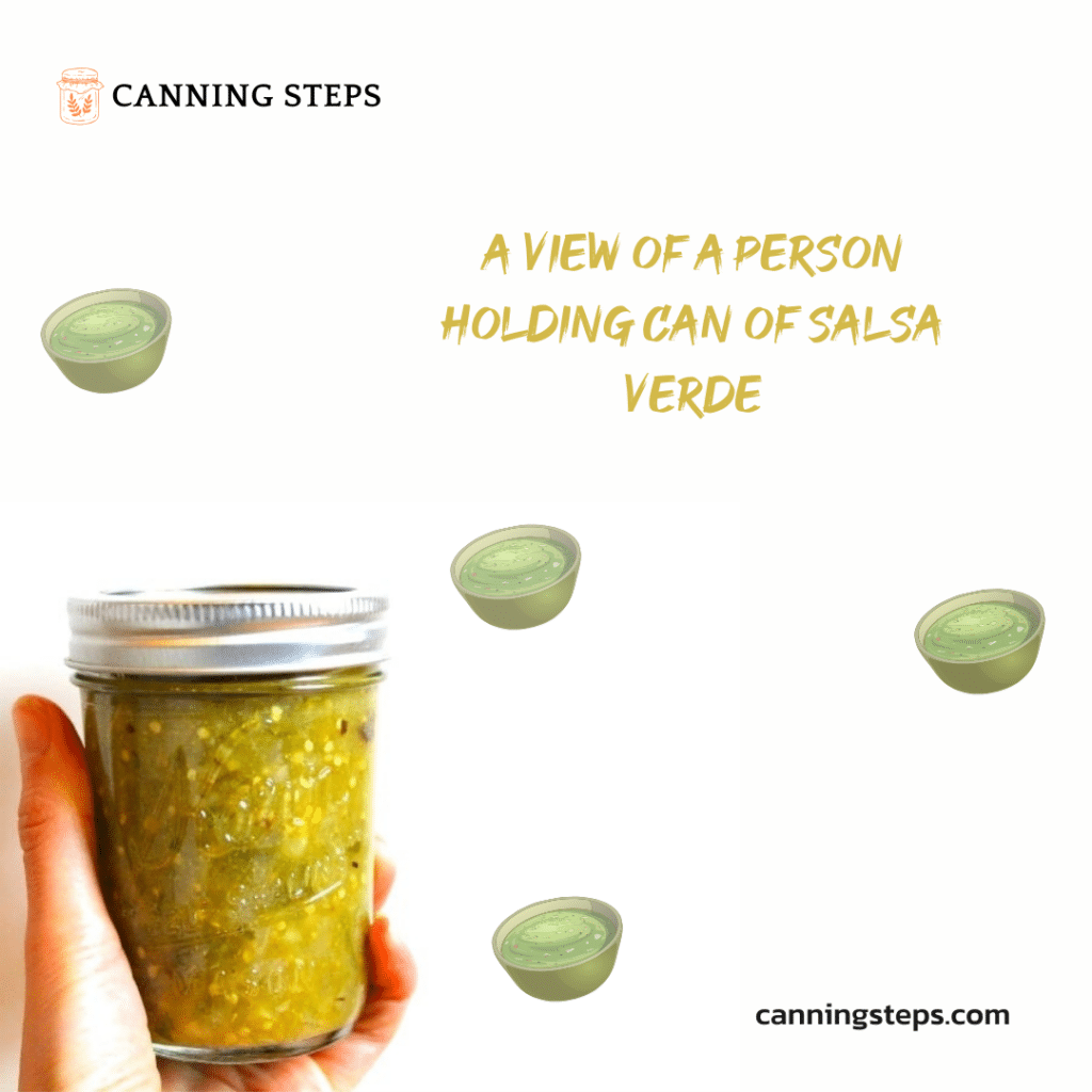 A view of a person holding a can of salsa verde