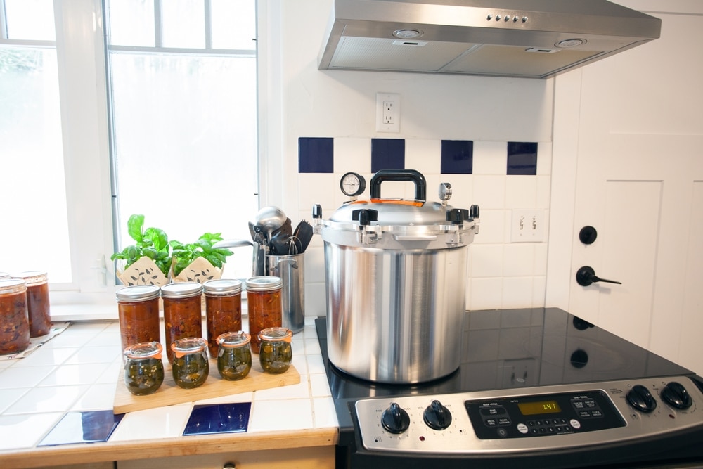 A view of a pressure cooker with canned recipes