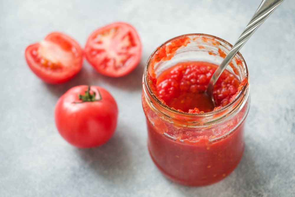 A view of a tomato paste inside a can