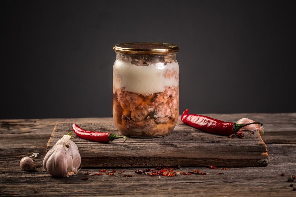 A view of beef canned with chillies on the side