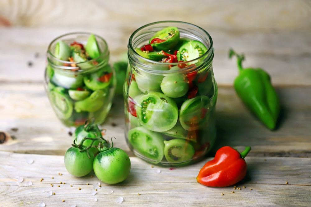 A view of green tomatoes inside a can