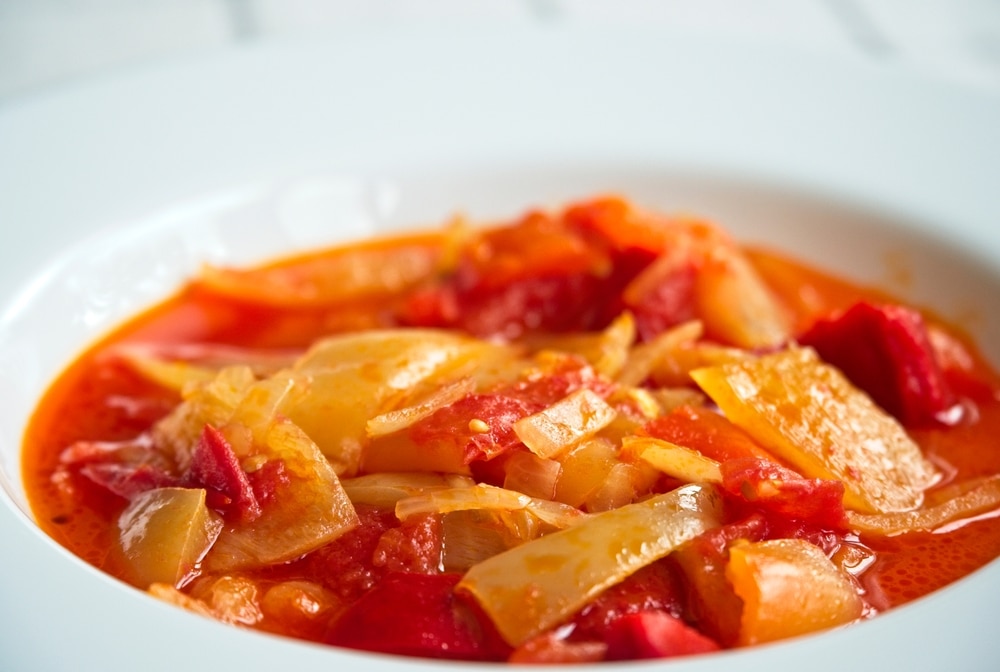 A view of stewed tomatoes inside a bowl