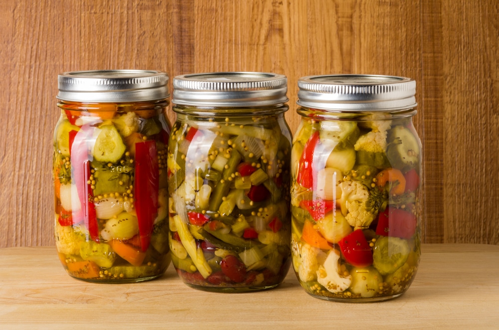 A view of veggies sealed in a glass mason jars