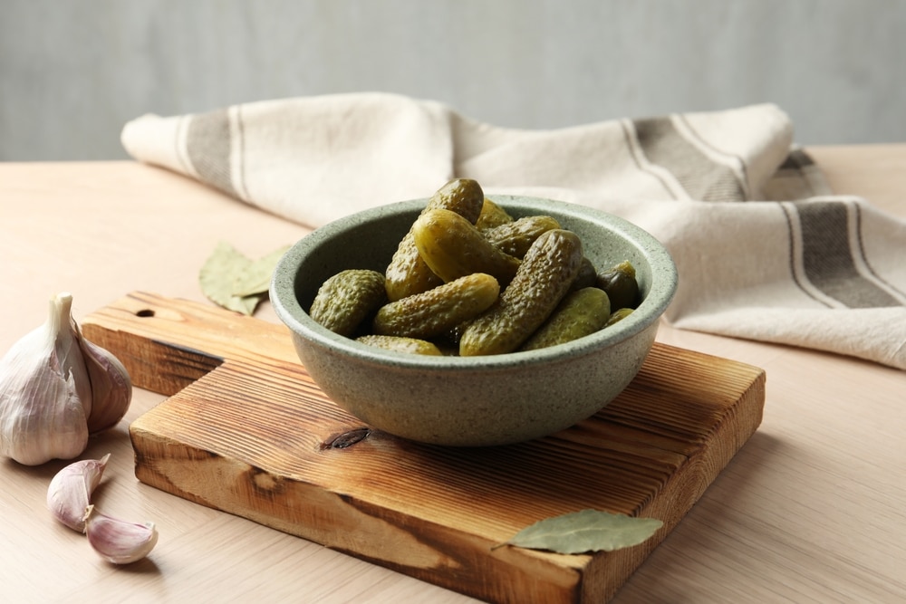 A view of pickled cucumbers inside a bowl