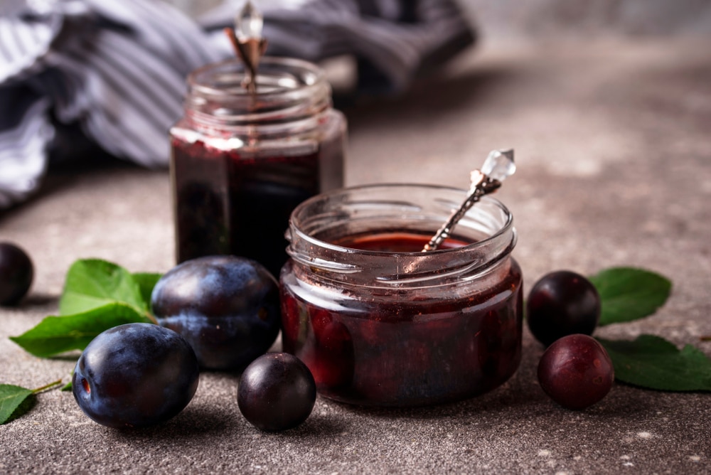 A view of plum jam inside a jar