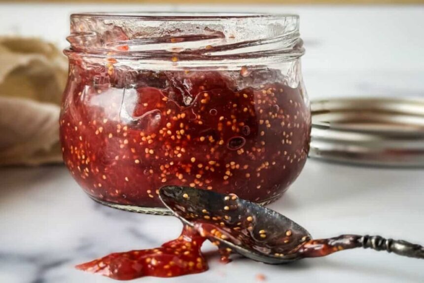 fig preserve in a jar along with the spoon full of fig jam