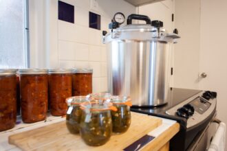 Home Canning Jalapenos In Jars And A Batch Of Chili