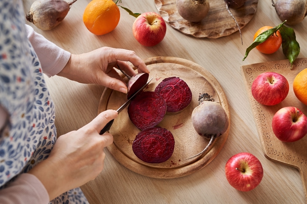 Woman Cutting Red Beet Root