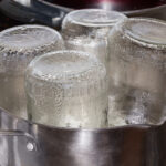 Glass Jars In The Stainless Steel Pot During Steam Sterilization