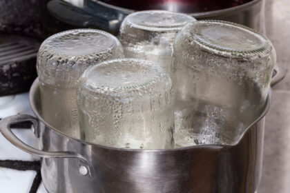 Glass Jars In The Stainless Steel Pot During Steam Sterilization