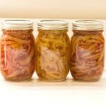 three jars of canned banana peppers