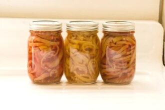 three jars of canned banana peppers