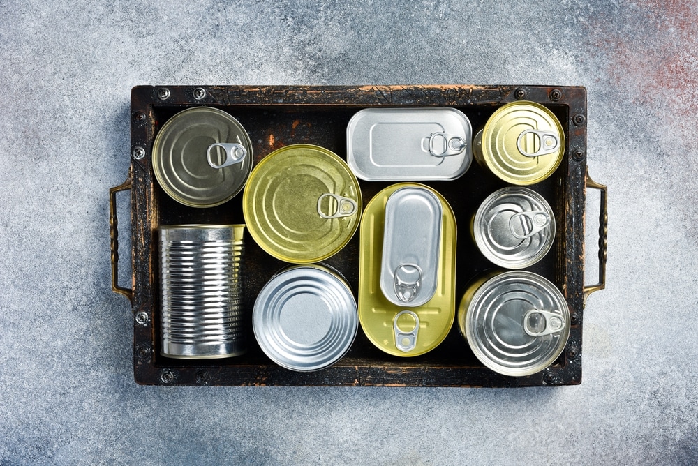 Metal Cans in a A Wooden Box 