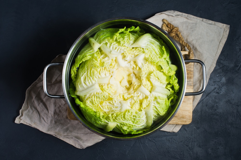 Savoy Cabbage In A Pot Of Boiling Water Dark Background