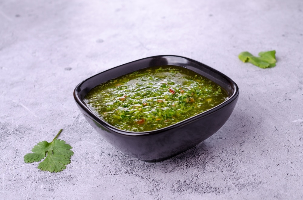 Green Sauce In Ceramic Dishes On A Gray Stone Background