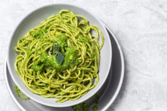 Spaghetti with homemade green tomato sauce and oregano