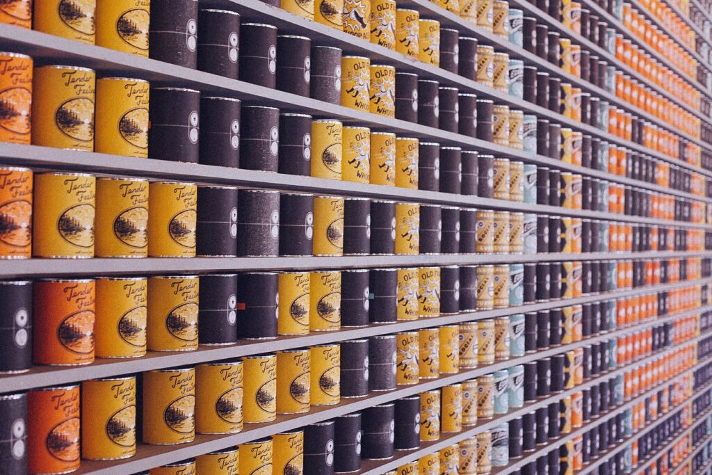 A view of line of cans in a supermarket A view of line of cans in a supermarket