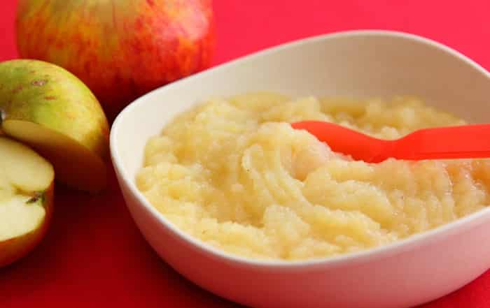 A view of soft baby food in a red bowl A view of soft baby food in a red bowl