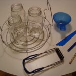 A view of three canning jars with measurers on the side