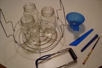 A view of three canning jars with measurers on the side