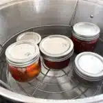 Jars being processed in a water bath canner